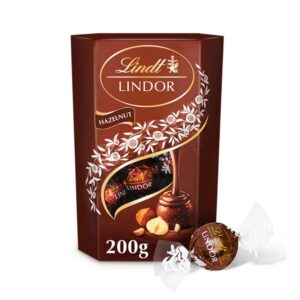 Бонбони Lindor Hazelnut лешников крем с парченца лешници 200гр